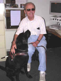 Jerry, N0VOE, and Guide Dog Trawler in the handiham office